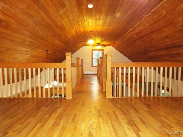 bonus room with light hardwood / wood-style flooring, vaulted ceiling, and wood ceiling