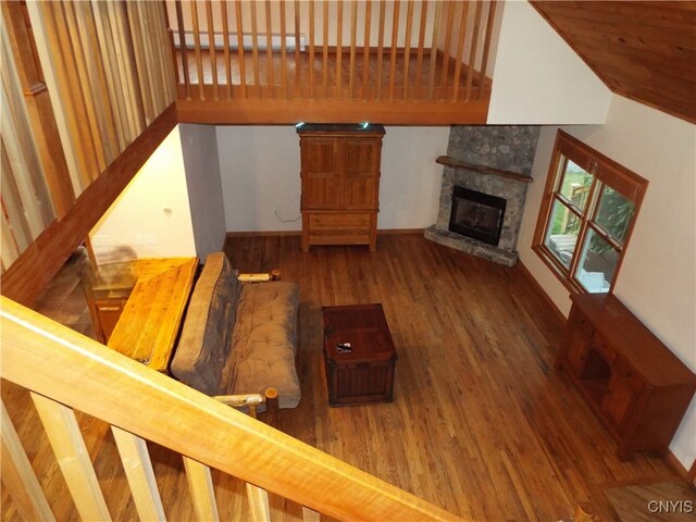 unfurnished living room featuring a fireplace and dark hardwood / wood-style flooring