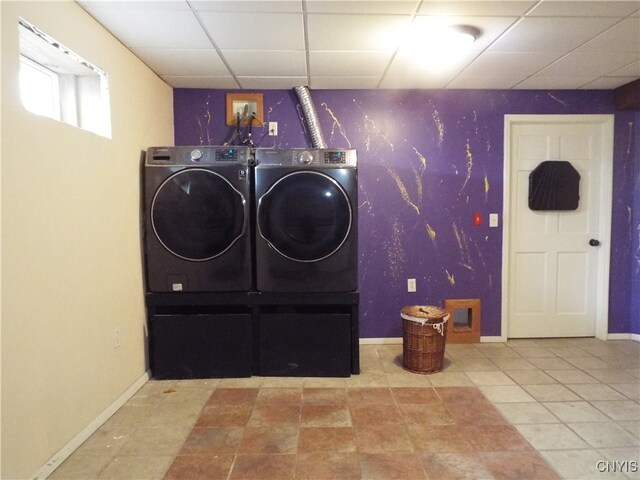 laundry area featuring tile patterned flooring and washer and dryer