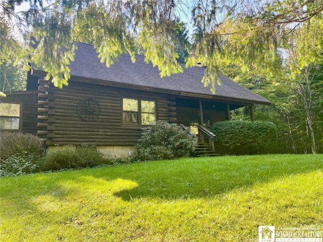 view of home's exterior with a lawn