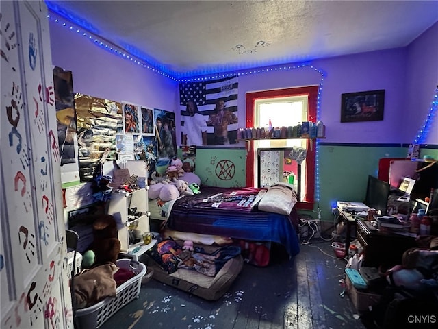 bedroom with hardwood / wood-style flooring