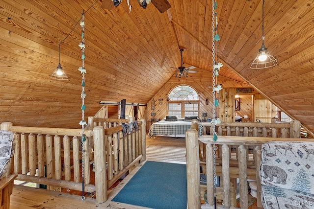 interior space featuring wood-type flooring, wooden walls, wood ceiling, and lofted ceiling