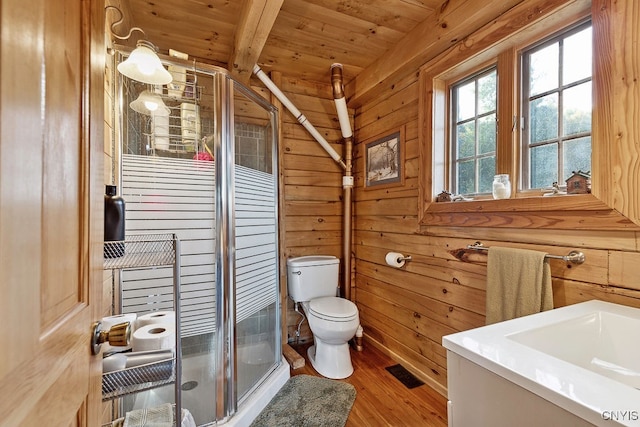 bathroom featuring vanity, wooden walls, wooden ceiling, walk in shower, and toilet