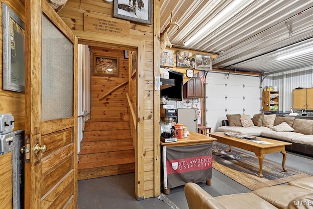 garage featuring wooden walls