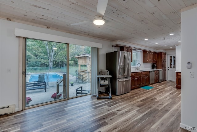 kitchen with dark brown cabinetry, sink, light hardwood / wood-style flooring, stainless steel appliances, and wooden ceiling