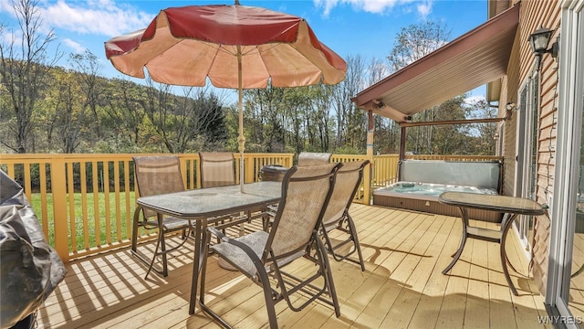 deck featuring a hot tub