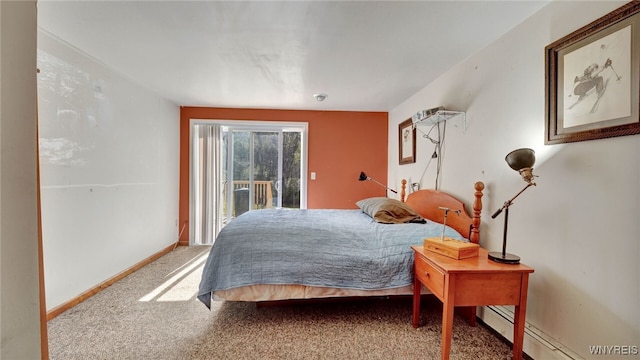 carpeted bedroom featuring access to exterior and a baseboard heating unit