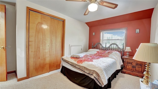 bedroom featuring lofted ceiling, a closet, and ceiling fan