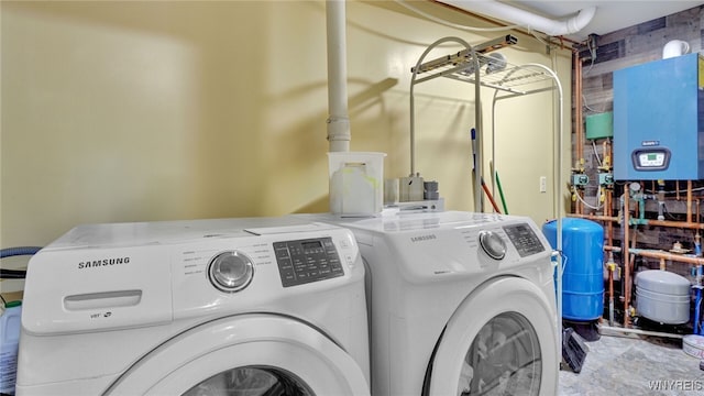 clothes washing area featuring washing machine and dryer