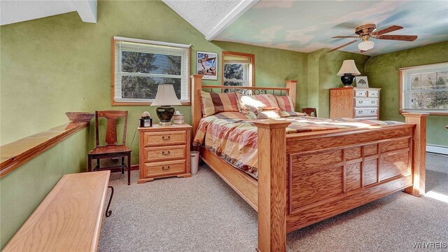 bedroom featuring vaulted ceiling, light colored carpet, and ceiling fan