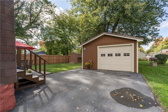 garage featuring a lawn