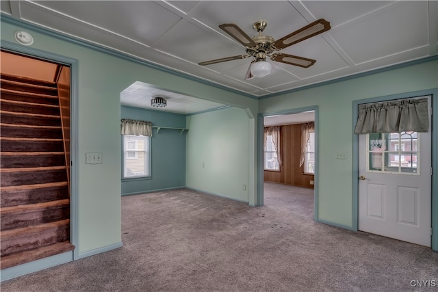 unfurnished room featuring light carpet and plenty of natural light