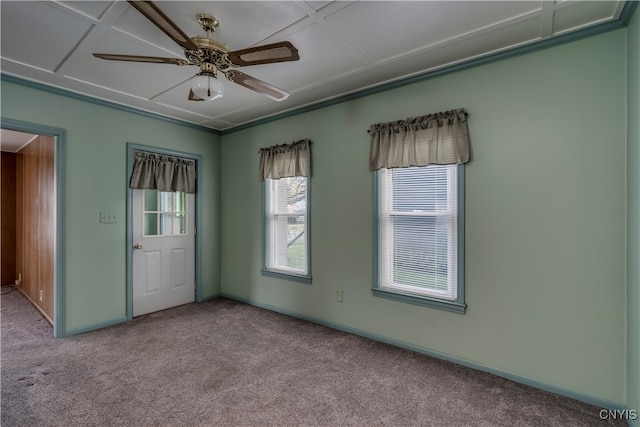 carpeted spare room featuring ceiling fan