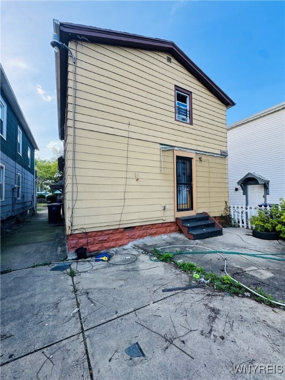 back of property with a patio area