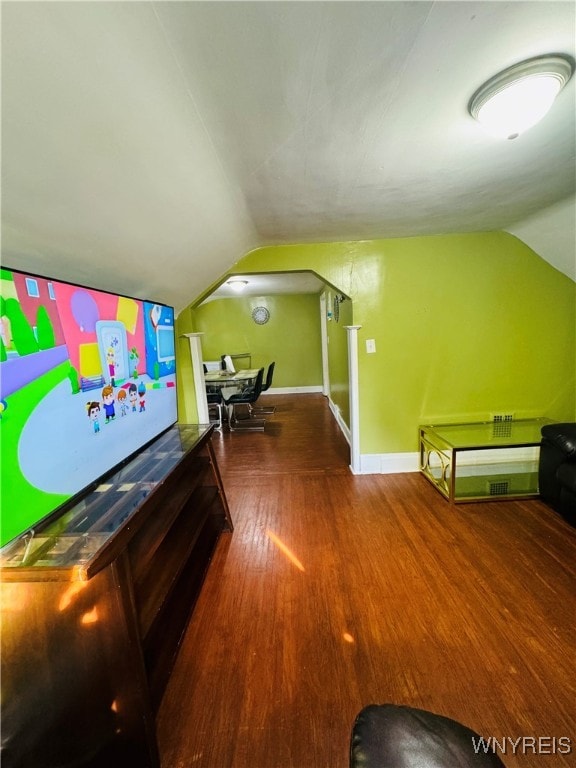 recreation room featuring vaulted ceiling and hardwood / wood-style flooring