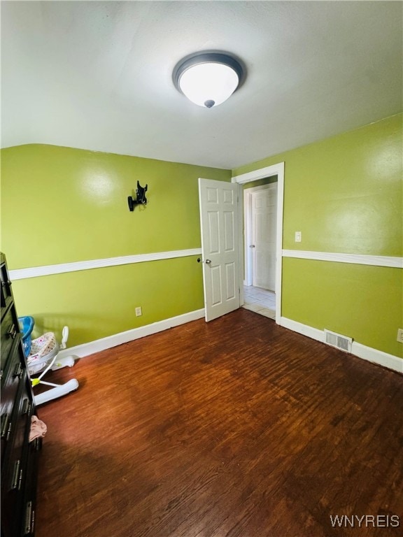 unfurnished bedroom featuring hardwood / wood-style flooring