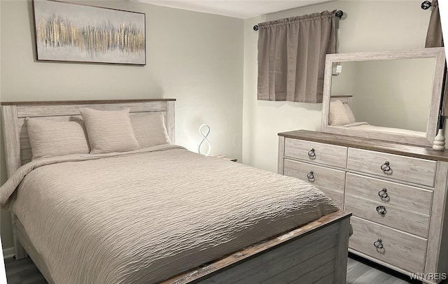 bedroom featuring dark hardwood / wood-style floors