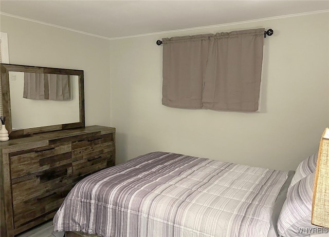 bedroom with ornamental molding