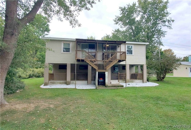 back of house featuring a yard