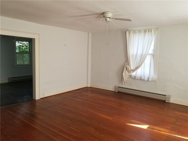 unfurnished room with baseboard heating, dark wood-type flooring, and ceiling fan