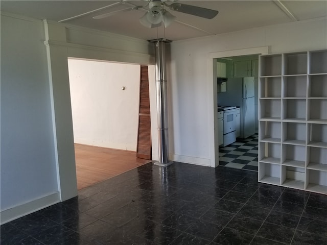 unfurnished room featuring dark hardwood / wood-style floors and ceiling fan