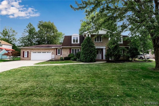 view of front facade with concrete driveway, brick siding, a garage, and a front lawn