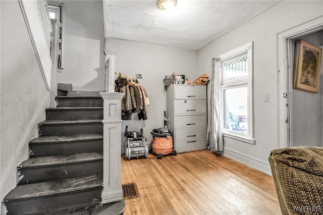 staircase featuring hardwood / wood-style floors