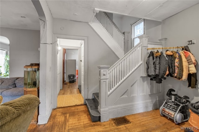 staircase featuring wood-type flooring