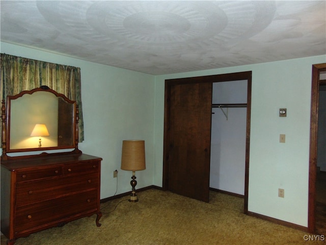 bedroom featuring light carpet and a closet