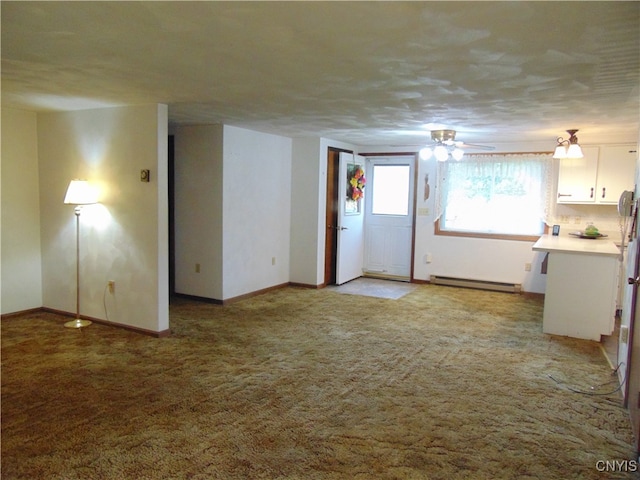 empty room with a baseboard radiator, light carpet, and ceiling fan