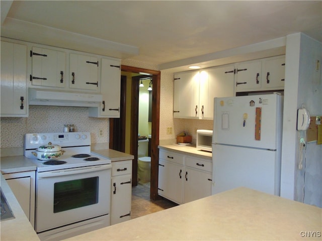 kitchen featuring white cabinetry, white appliances, and backsplash