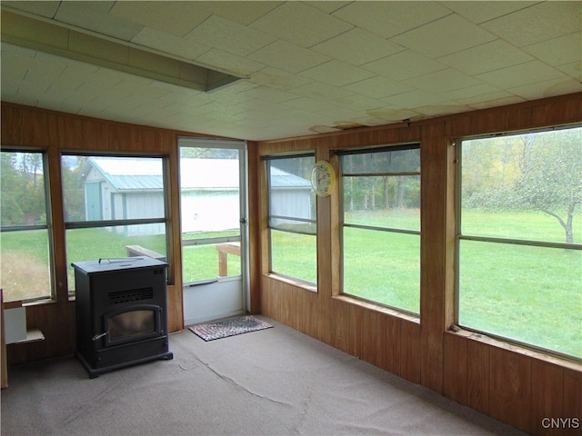 sunroom with a wood stove