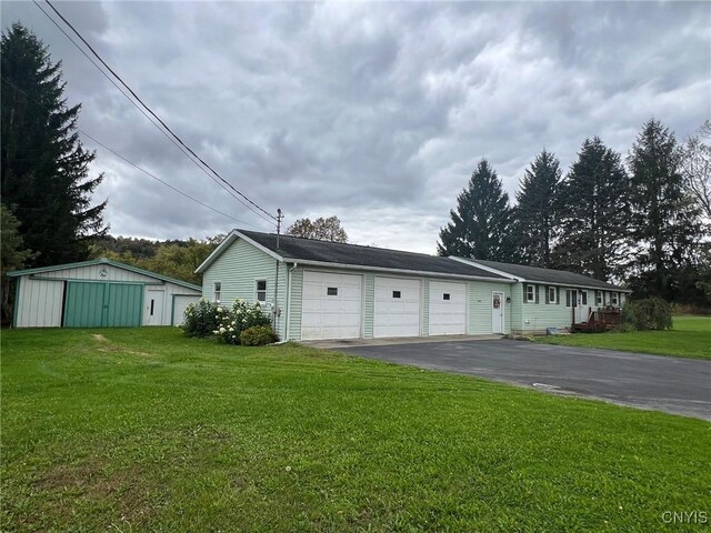 garage with a yard