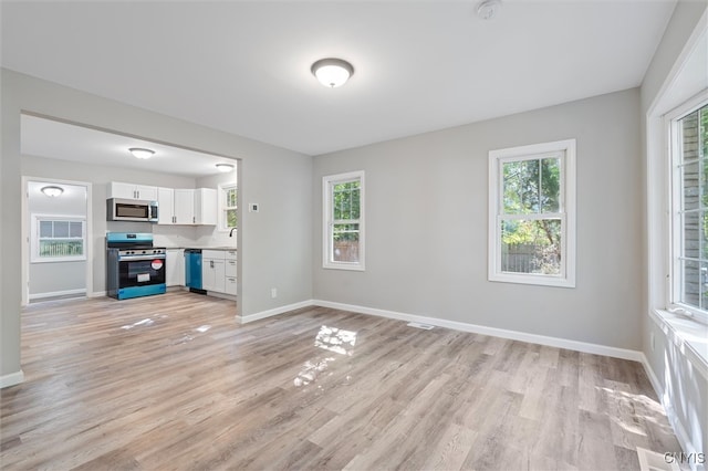 unfurnished living room featuring light wood-type flooring