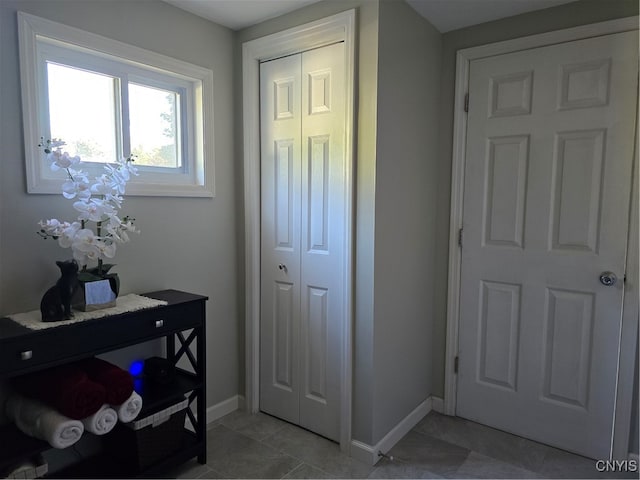 entryway featuring light tile patterned floors