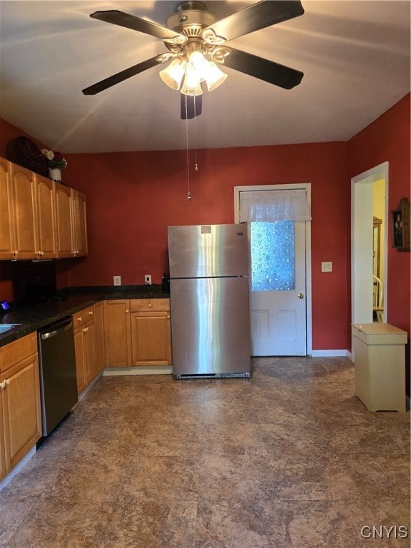 kitchen with appliances with stainless steel finishes and ceiling fan