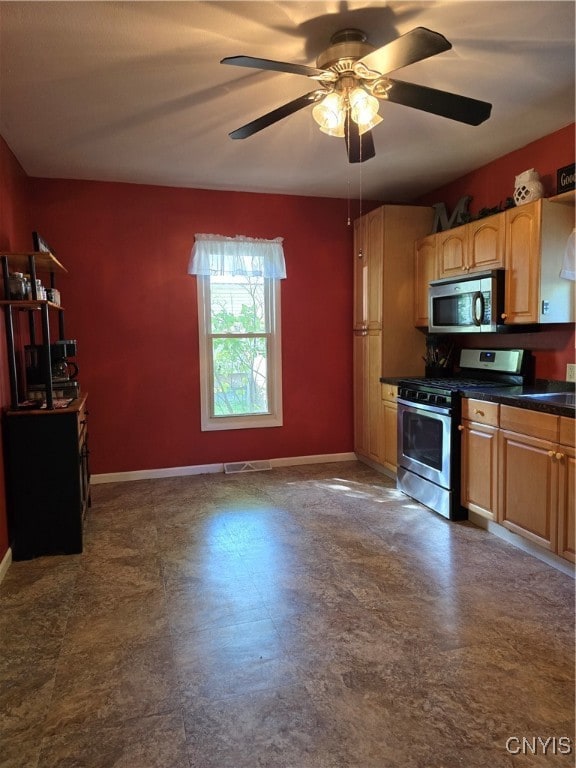 kitchen featuring appliances with stainless steel finishes and ceiling fan