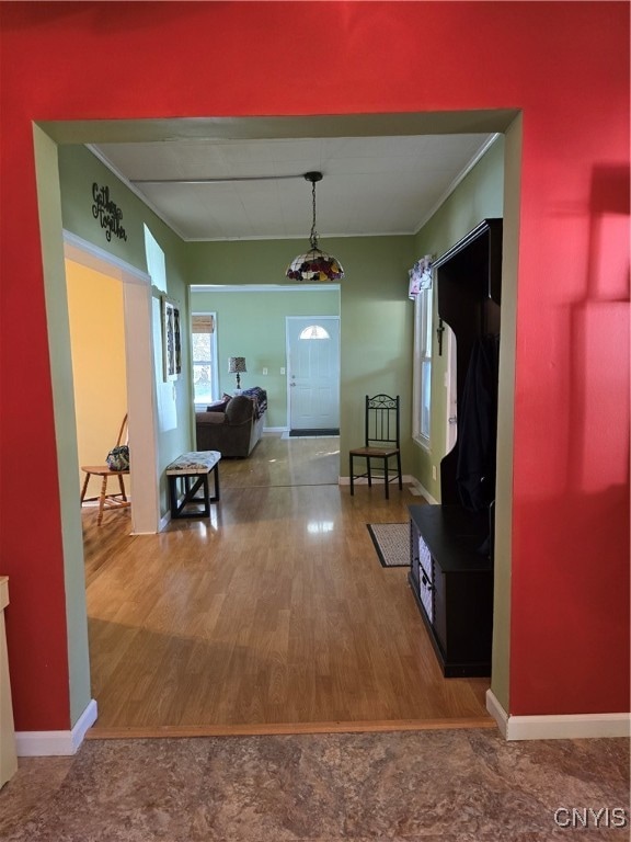 hall with hardwood / wood-style floors