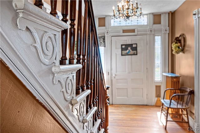 foyer featuring a notable chandelier and light wood-type flooring