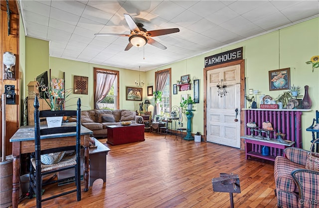 living room featuring hardwood / wood-style floors and ceiling fan