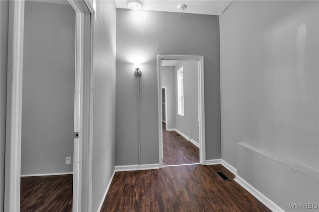 hallway featuring dark hardwood / wood-style floors