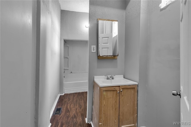 bathroom with vanity and hardwood / wood-style flooring