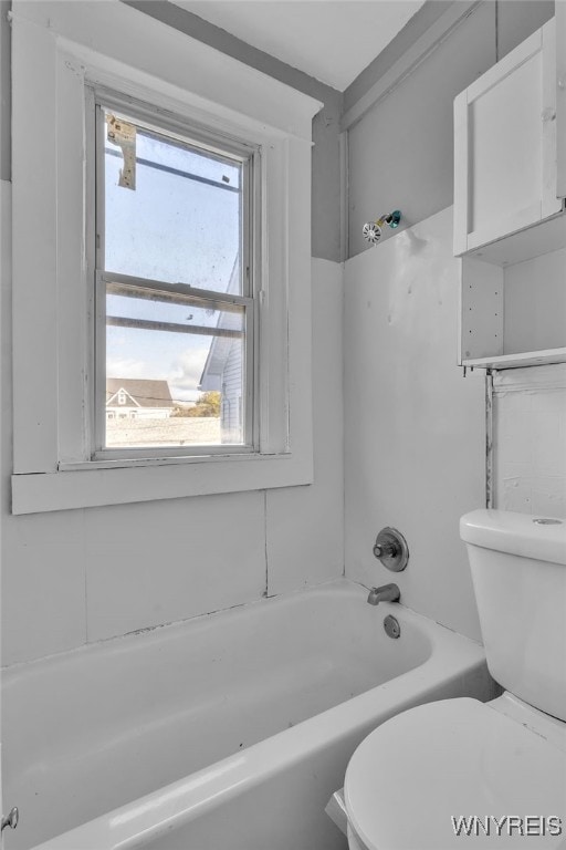 bathroom with shower / bath combination and toilet