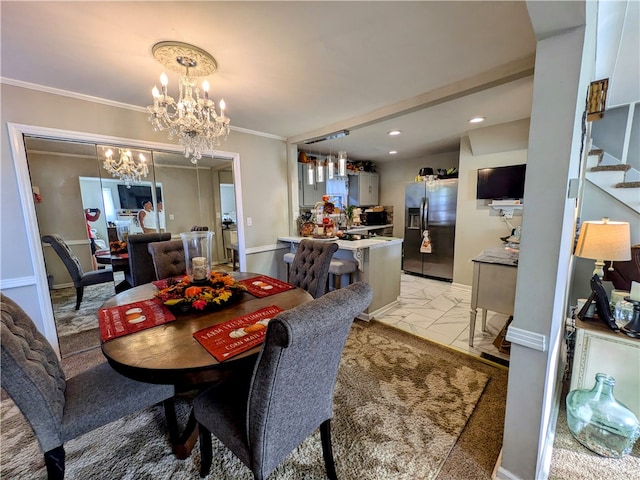 dining area with ornamental molding and an inviting chandelier