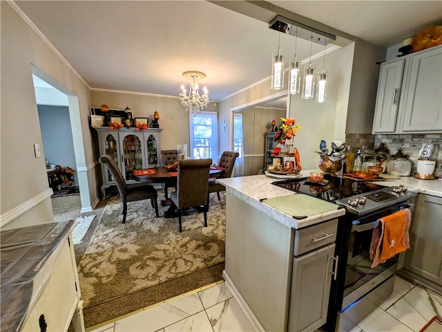 kitchen featuring pendant lighting, black range with electric cooktop, tasteful backsplash, and gray cabinetry