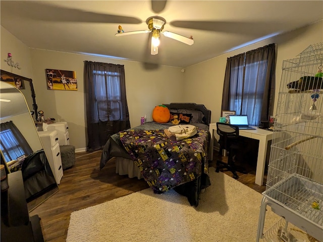 bedroom featuring ceiling fan and dark hardwood / wood-style flooring