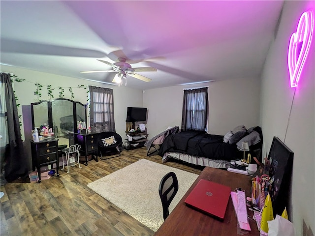 bedroom featuring hardwood / wood-style floors and ceiling fan