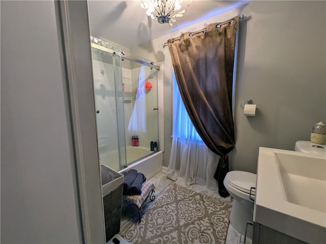 full bathroom featuring vanity, combined bath / shower with glass door, tile patterned flooring, toilet, and a notable chandelier