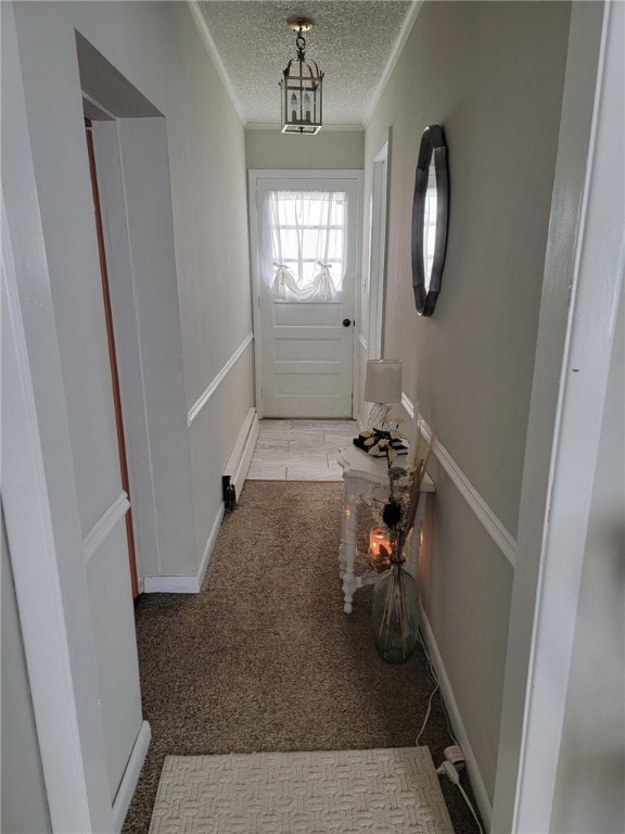 53 Orchard Pl, Bradford City, PA 16701 - doorway to outside featuring crown molding, a textured ceiling, carpet floors, and baseboard heating
