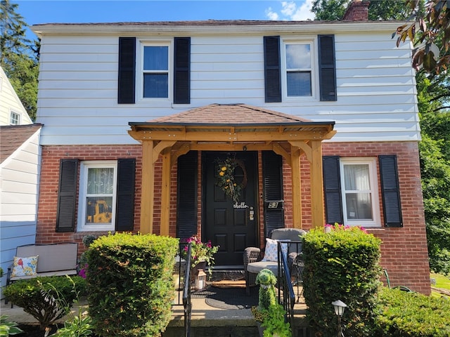 53 Orchard Pl, Bradford City, PA 16701 - view of front facade with brick siding and a chimney